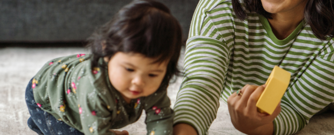 A mother playing with her young daughter to show how counselling can help parenting issues.