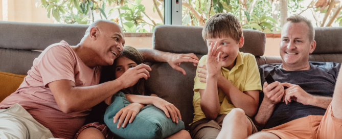 A gay couple with kids used to illustrate family concerns in counselling.
